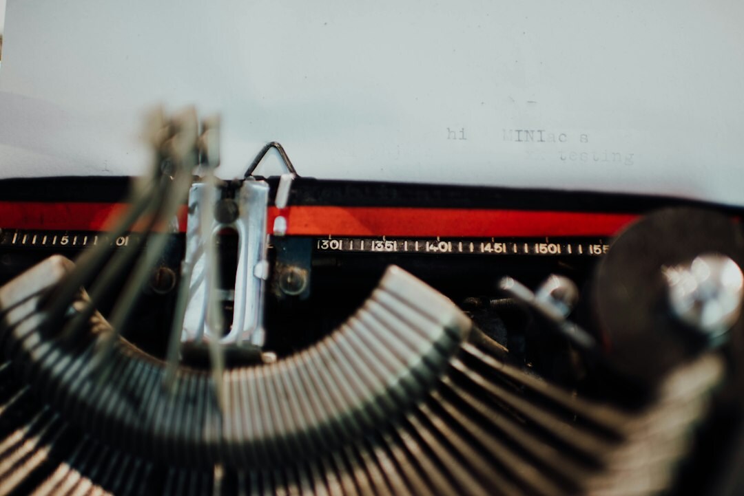 Close up of an old mechanical typewriter with a sheet of paper